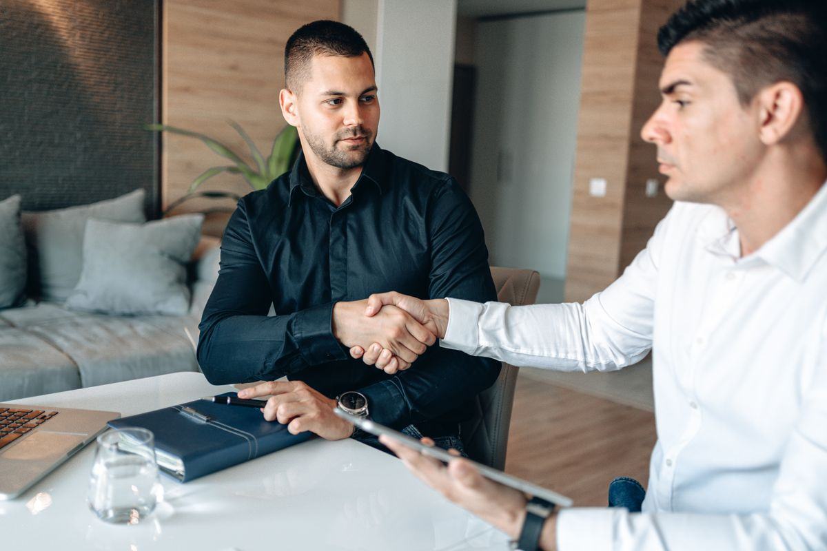 Two professionals shaking hands