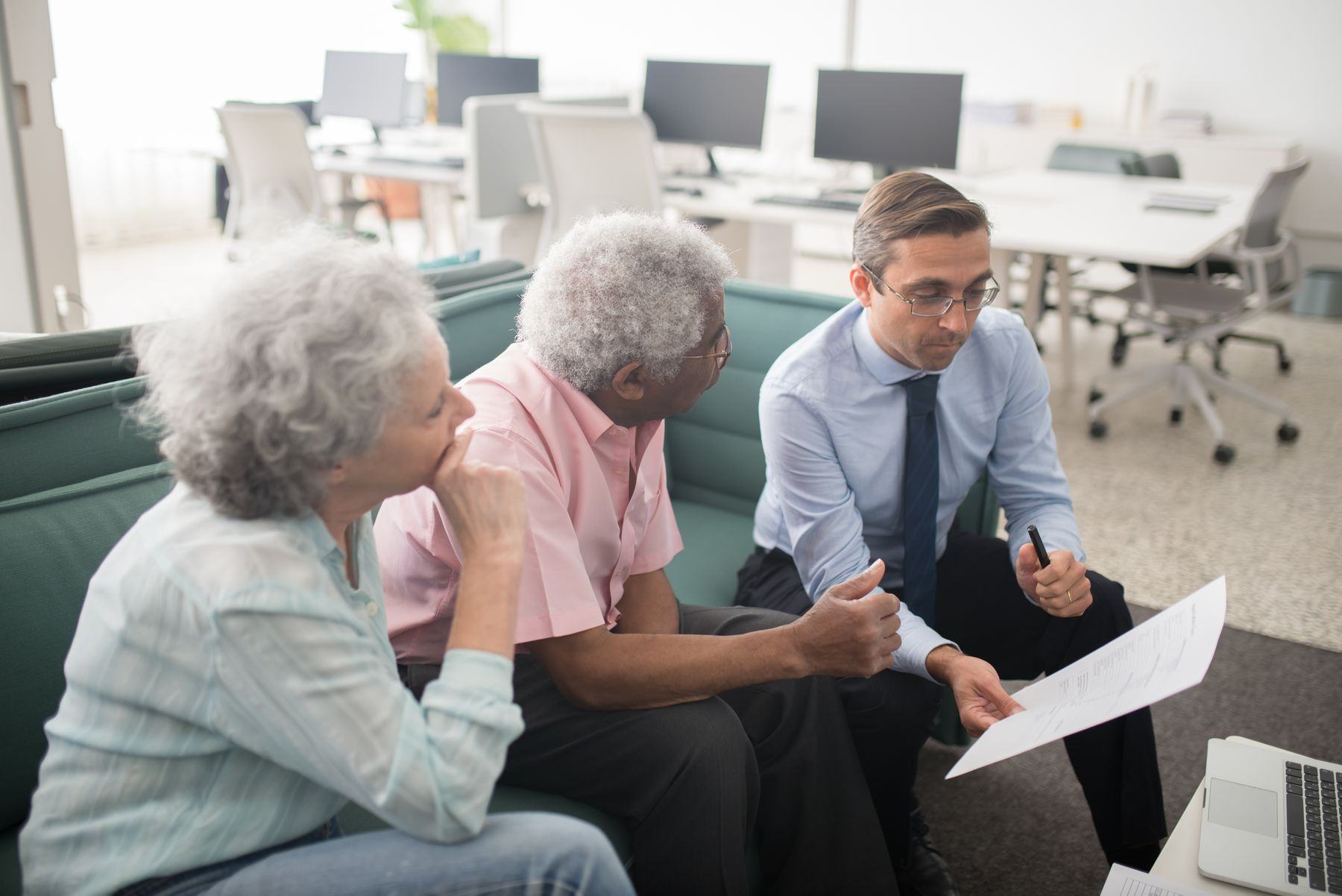 An advisor walking a retired couple through a document